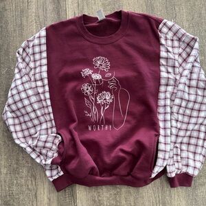 Reworked up-cycled sweatshirt with flannel sleeves and pockets.